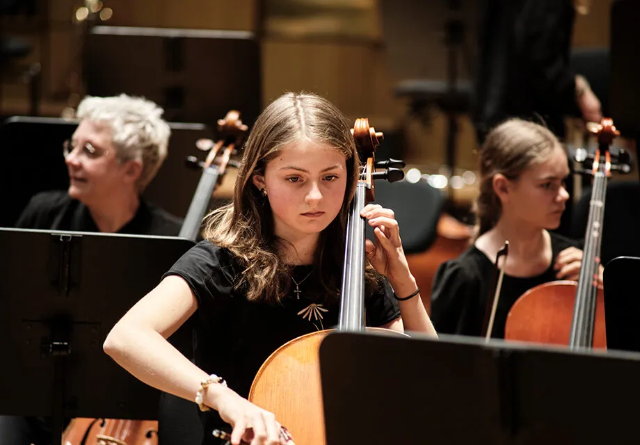 Young musician with her cello in SKUSO Youth orchestra