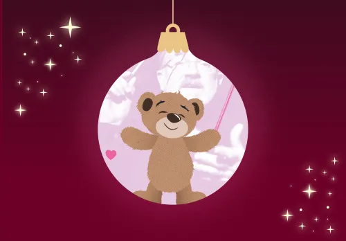 Nalle inuti en julgranskula.